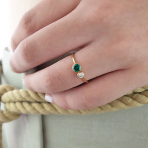 Two stone diamond emerald ring