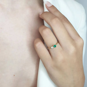 Two stone diamond emerald ring