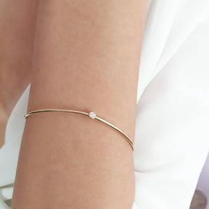 “Wave” Bangle with diamond in solid gold